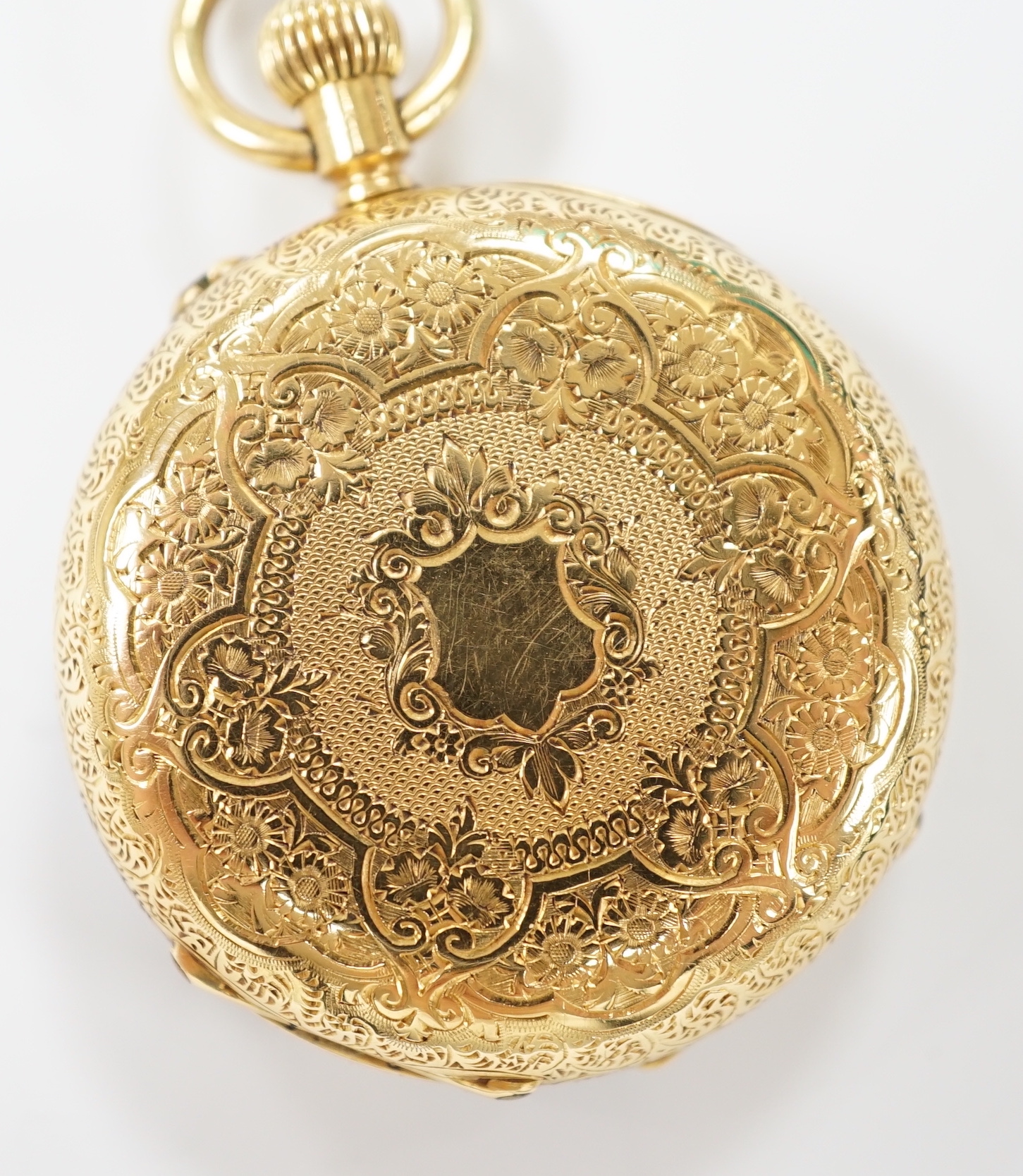 An early 20th century engraved 18k open face keyless fob watch